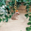 Capybara with orange - Cows in Clouds - Brelok